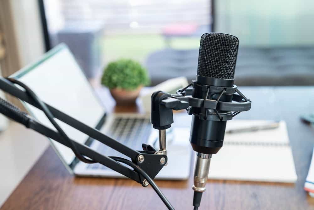 Laptop and microphone ready for online singing lessons