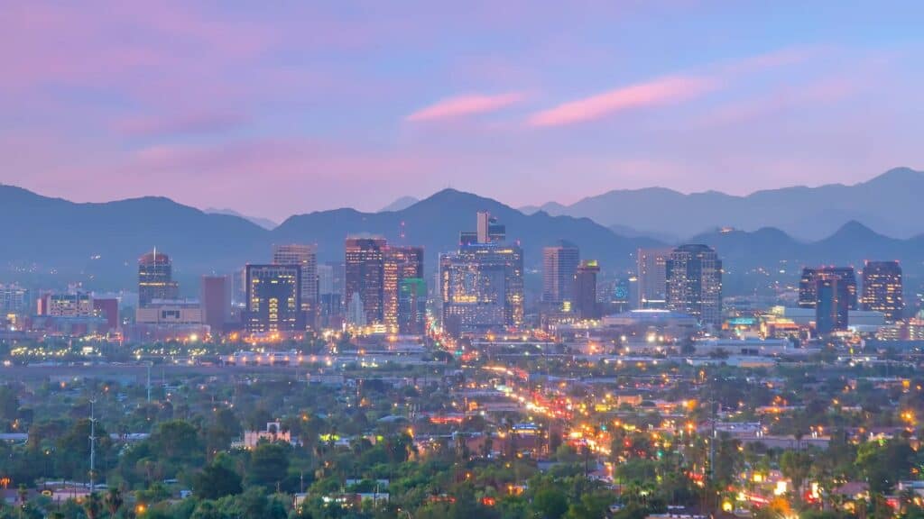 Photo of the Phoenix Arizona skyline at dusk with city lights